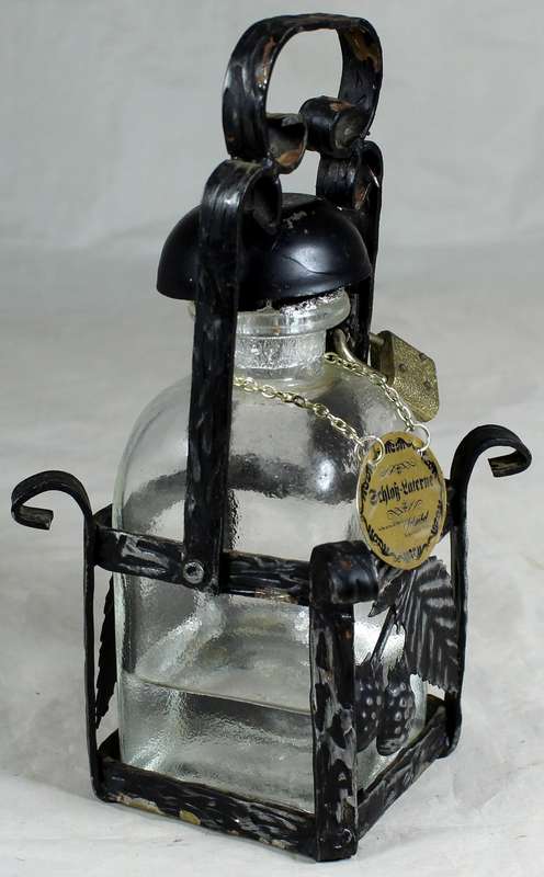 Metal Tantalus with bottle