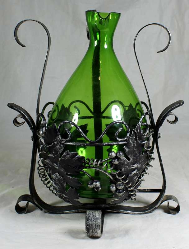 Large metal swing with green decanter