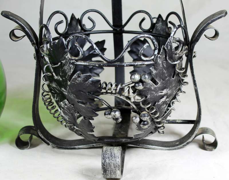 Large metal swing with green decanter