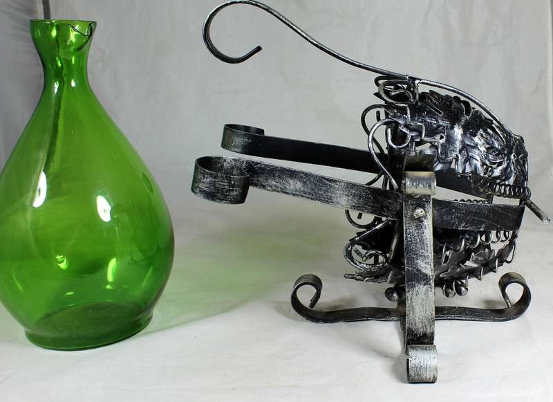 Large metal swing with green decanter