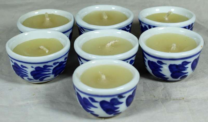 Set of seven candles in porcelain holders