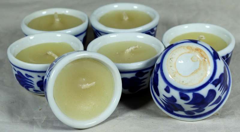 Set of seven candles in porcelain holders