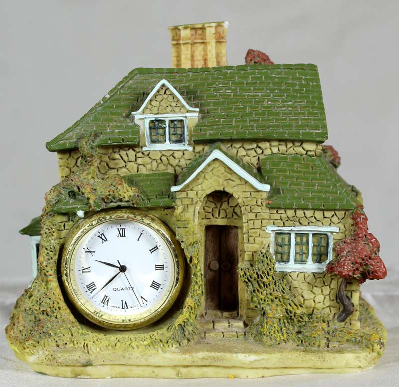 Molded house with clock