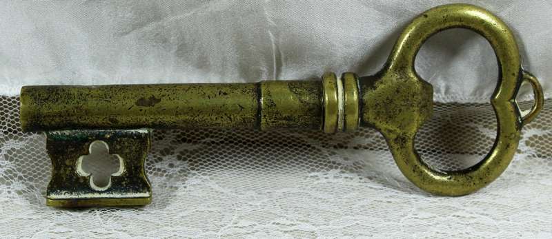 Bronze key bottle opener with cork puller