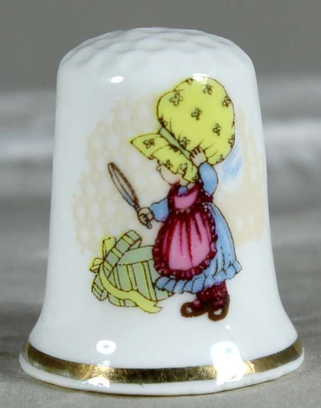 Bone China thimble - little girl with magnifying glass