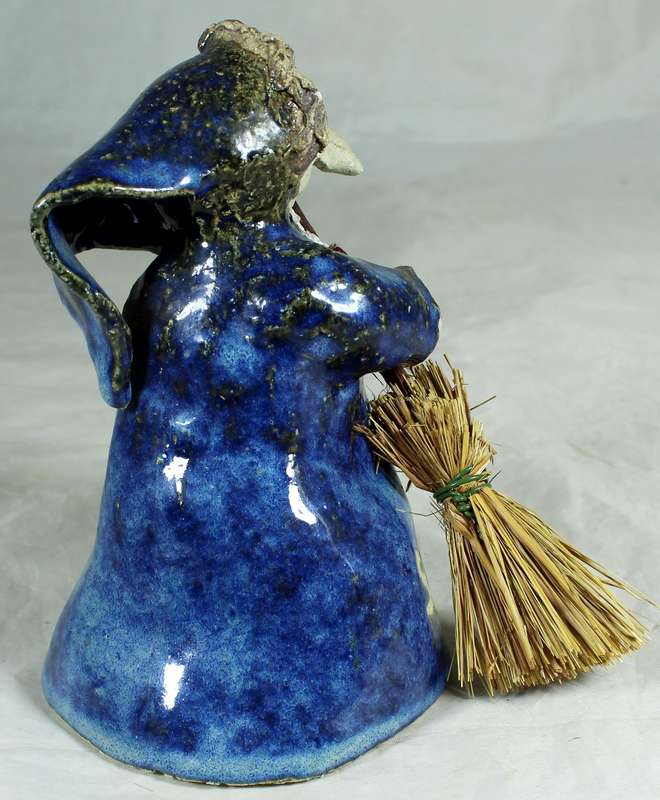 Pottery witch with broom in blue coat