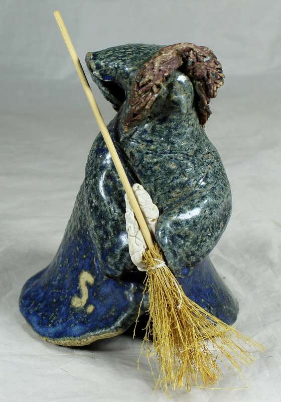 Pottery witch with broom in blue/green coat