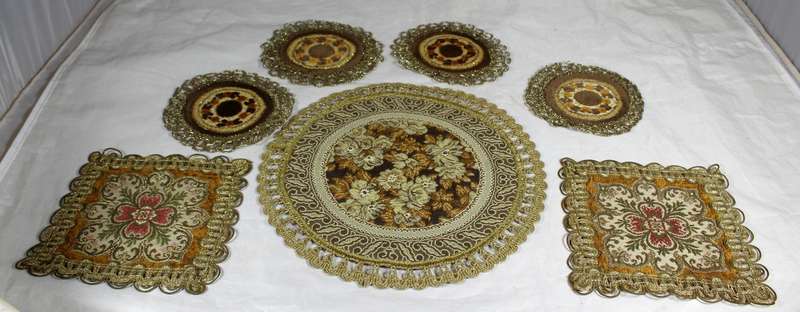 Set of seven ornate place mats
