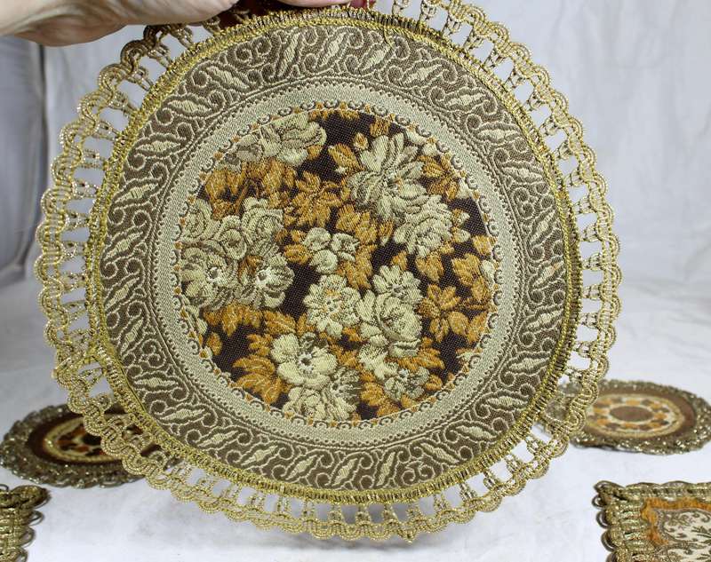 Set of seven ornate place mats