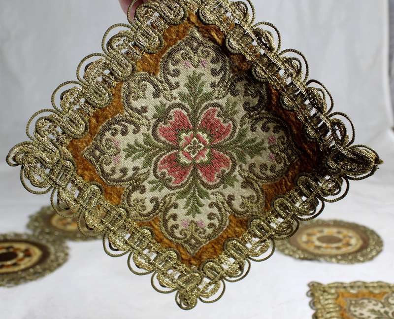 Set of seven ornate place mats