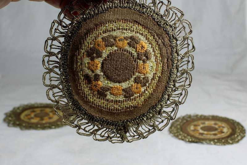 Set of seven ornate place mats