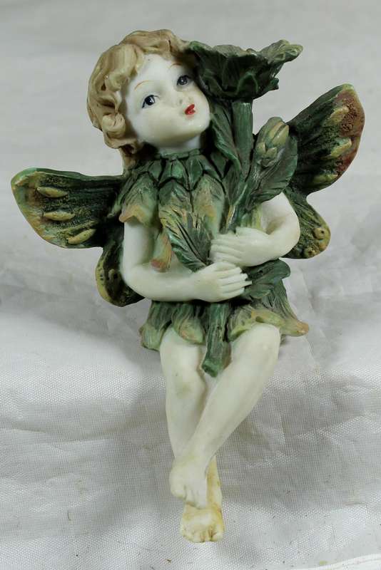 Seated little angel