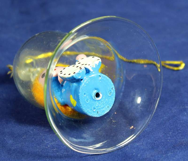Vintage wooden doll in glass dome