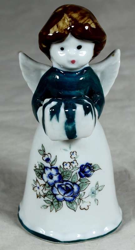Porcelain bell with angel holding a present