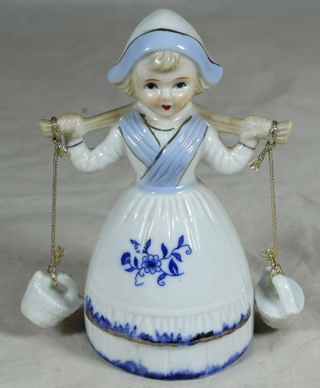 Porcelain bell with girl holding two baskets