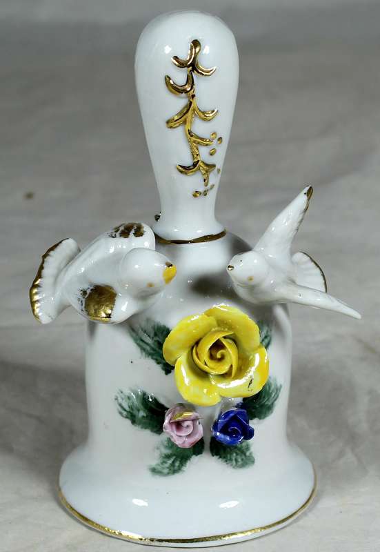 Porcelain bell with doves and yellow rose
