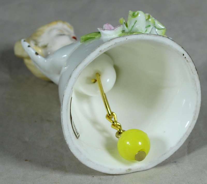 Porcelain bell - little angel with yellow flowers