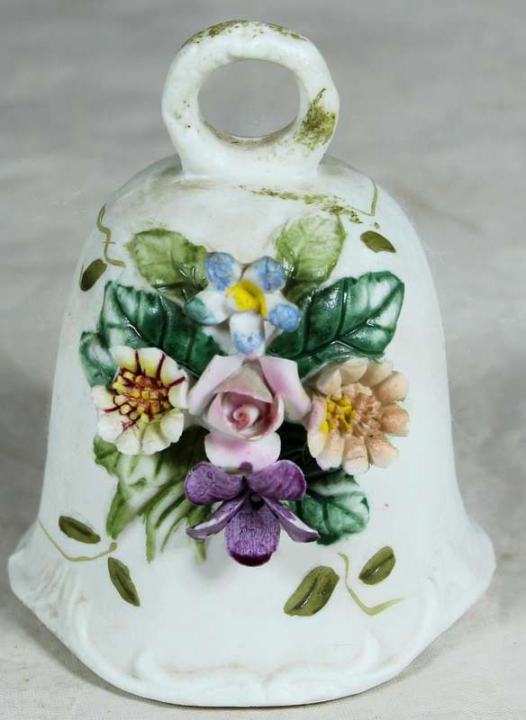 Ceramic bell with embossed flowers
