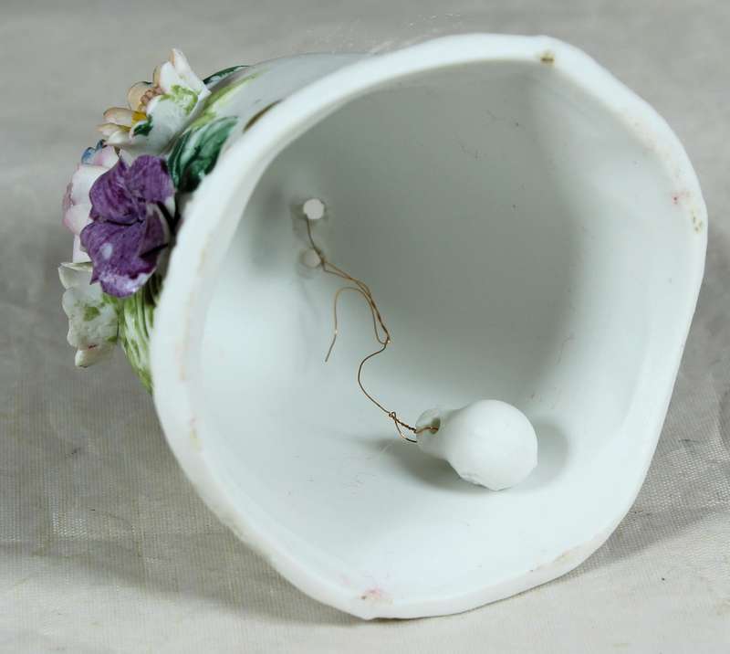Ceramic bell with embossed flowers
