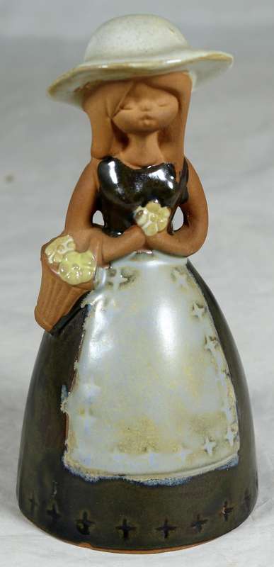 Pottery bell - girl with flowers
