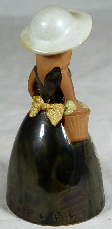 Pottery bell - girl with flowers