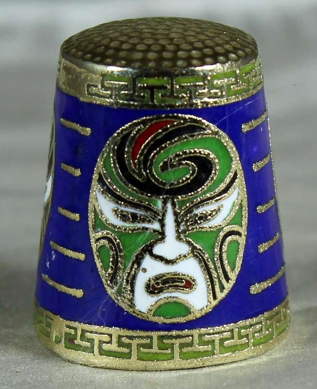 Cloissone thimble - oriental masks