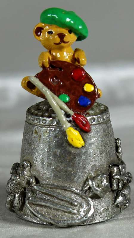 Teddy bear artist on a pewter thimble