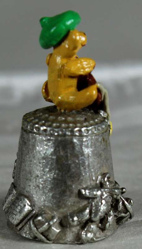 Teddy bear artist on a pewter thimble