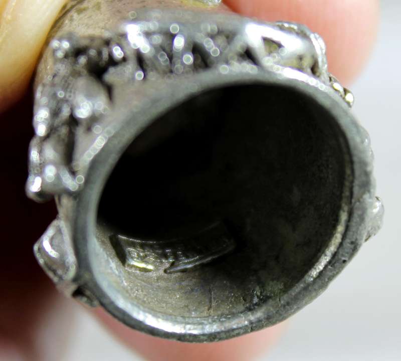 Teddy bear artist on a pewter thimble