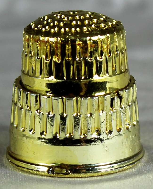 Gold colored thimble
