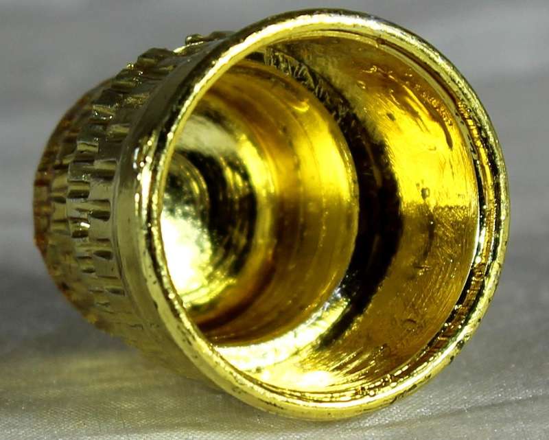 Gold colored thimble