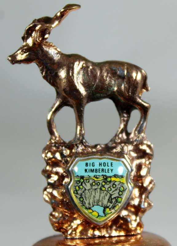 Souvenir copper bell - big hole Kimberley with Kudu topped figurine