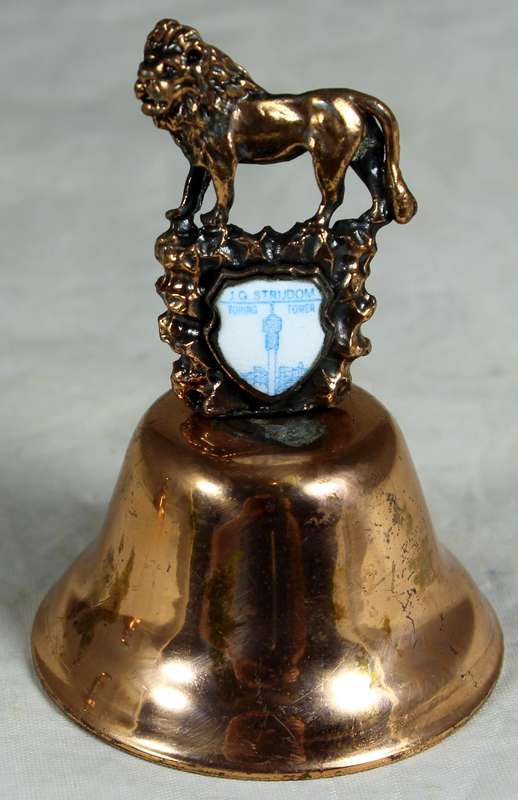 Souvenir copper bell - JG Strydom tower with lion topped figure