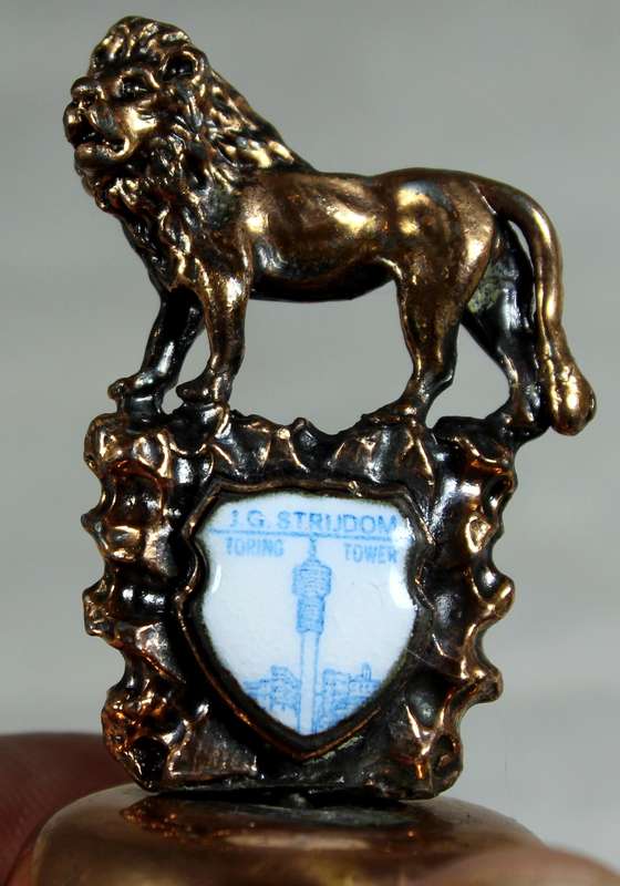 Souvenir copper bell - JG Strydom tower with lion topped figure