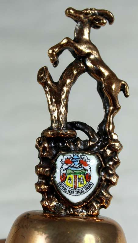 Souvenir copper bell - Royal national park with springbok topped figure