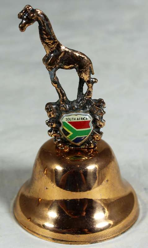 Souvenir copper bell - South Africa with giraffe topped figure