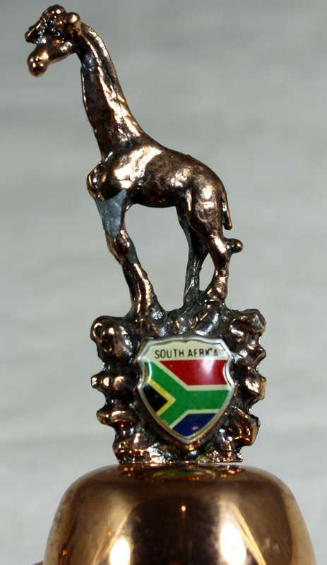 Souvenir copper bell - South Africa with giraffe topped figure