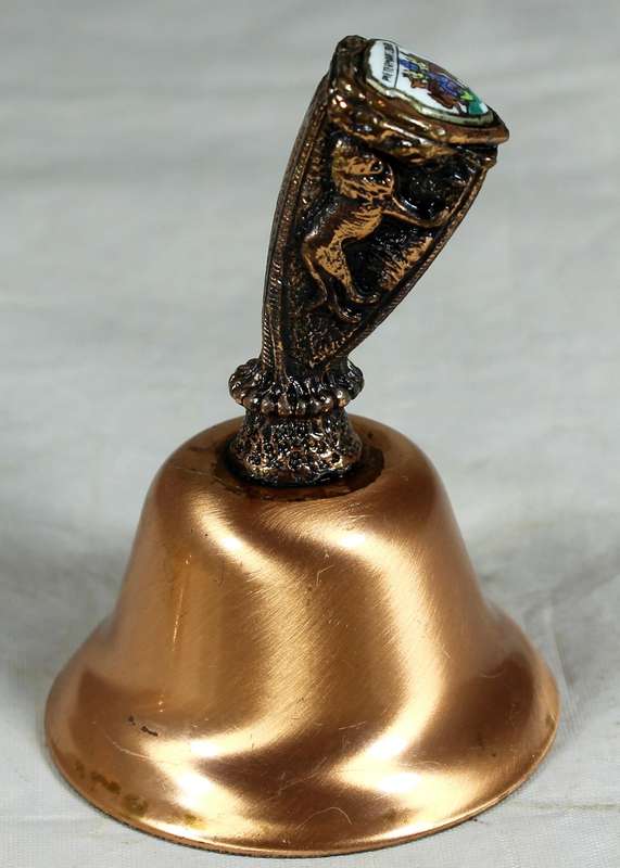 Souvenir copper bell - Pietermaritzburg with lion topped figure embossed to shield