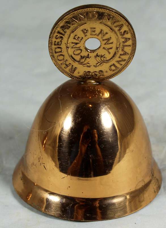Souvenir copper bell with Rhodesia and Nyasaland coin