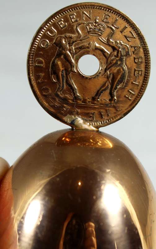 Souvenir copper bell with Rhodesia and Nyasaland coin