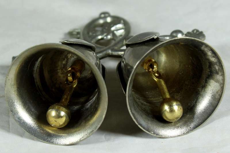 Silver plated bells on a branch
