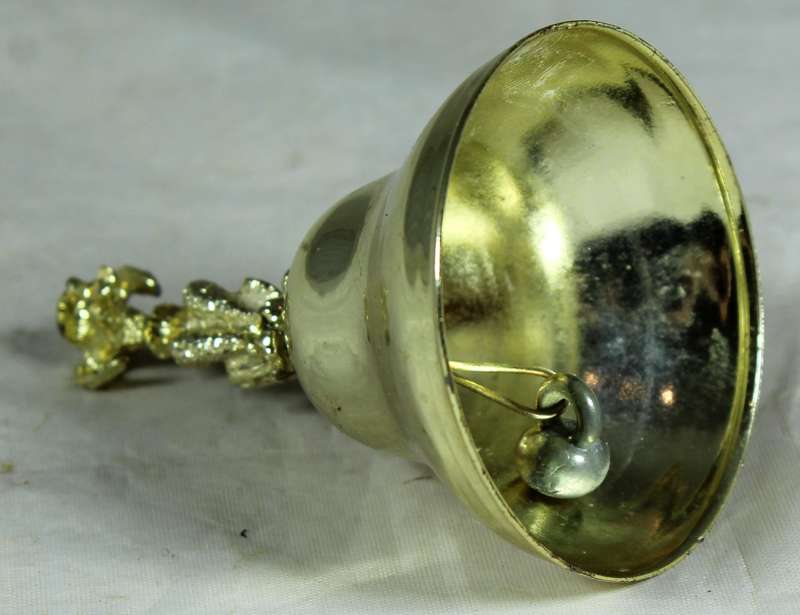 Gold tone bell with doggy figure