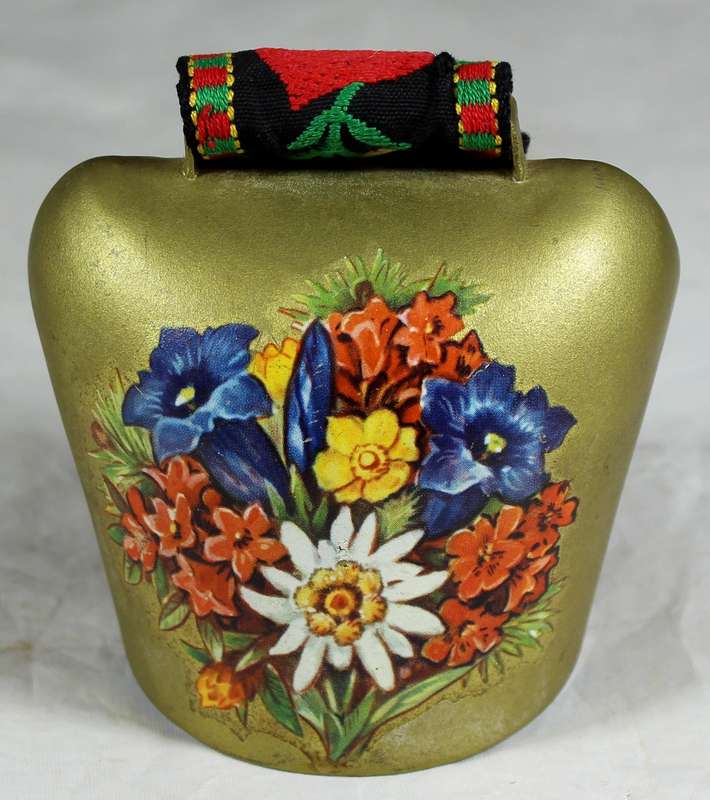 Cow bell with decorative strap