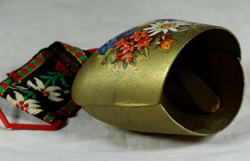 Cow bell with decorative strap