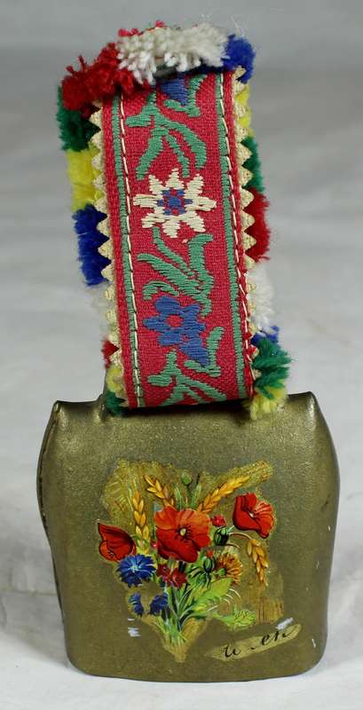 Cow bell with decorative strap