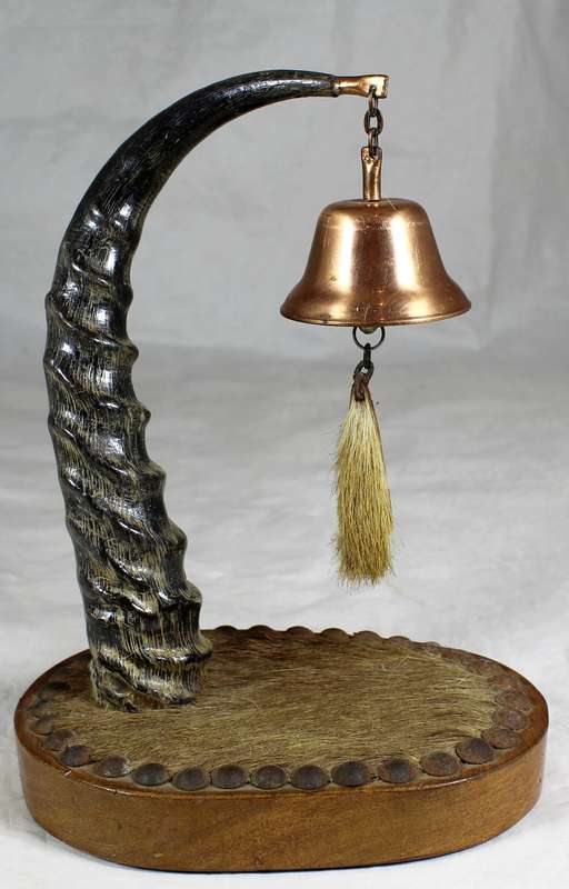 Composition horn and hide table bell
