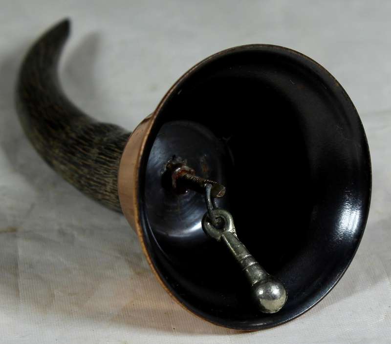 Copper bell with a horn