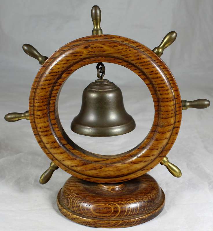 Wooden ships wheel with bell