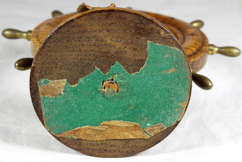 Wooden ships wheel with bell