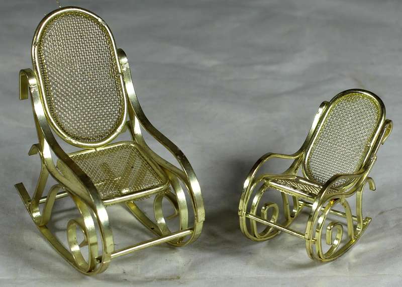 Pair of brass rocking chairs